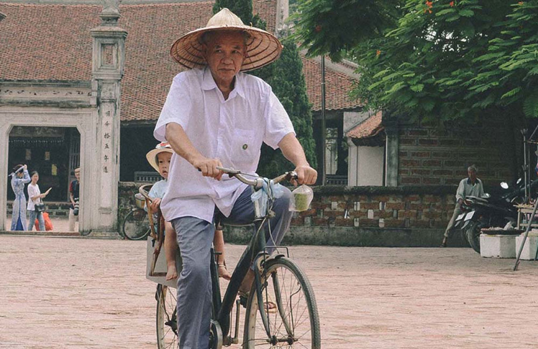 Man and a child on a bicycle