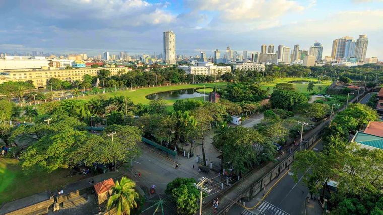 Aerial view across a green space in a city