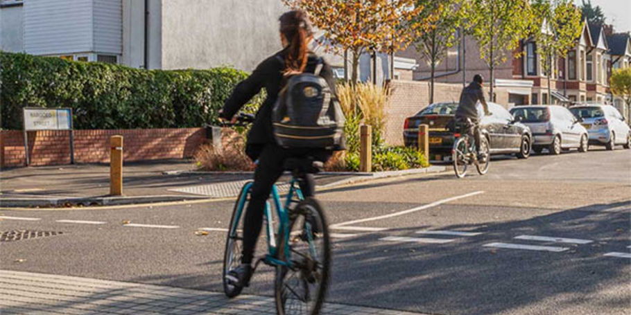 Cycling and walking on a street in Britain