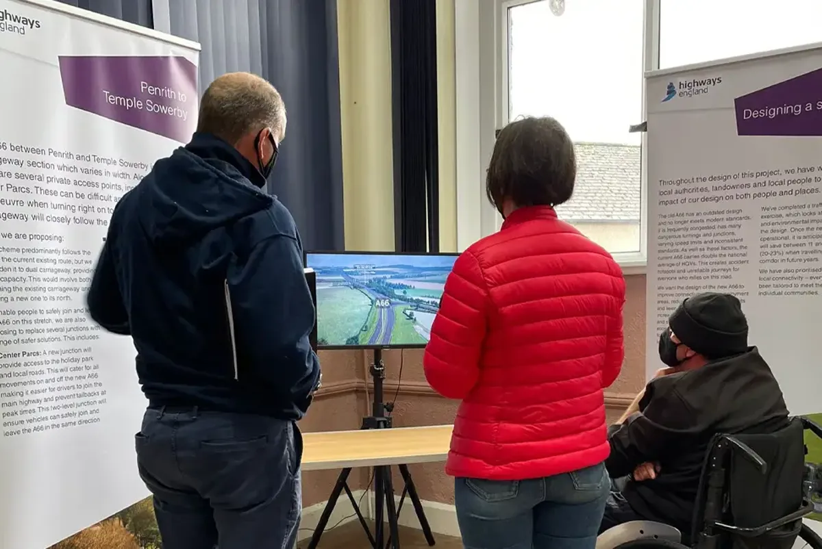 People looking at screen at public consultation event at Kirby Thore venue