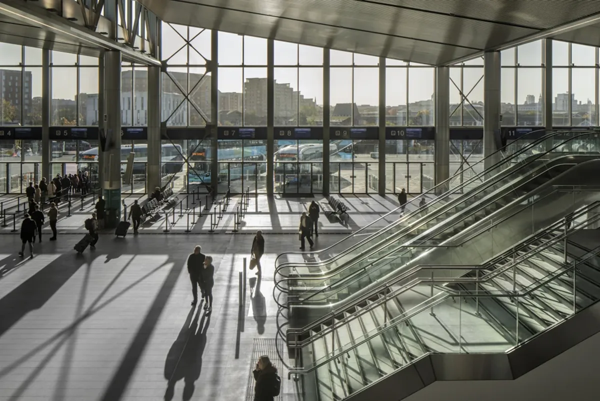 Inside Belfast Grand Central Station with view of bus stops outside