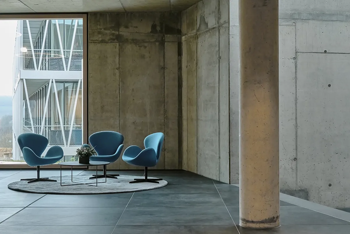 Lounge area in the connecting terminal with views of the countryside. © Arup