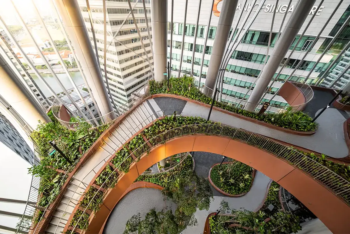 Landscaped gardens inside a tall glass building