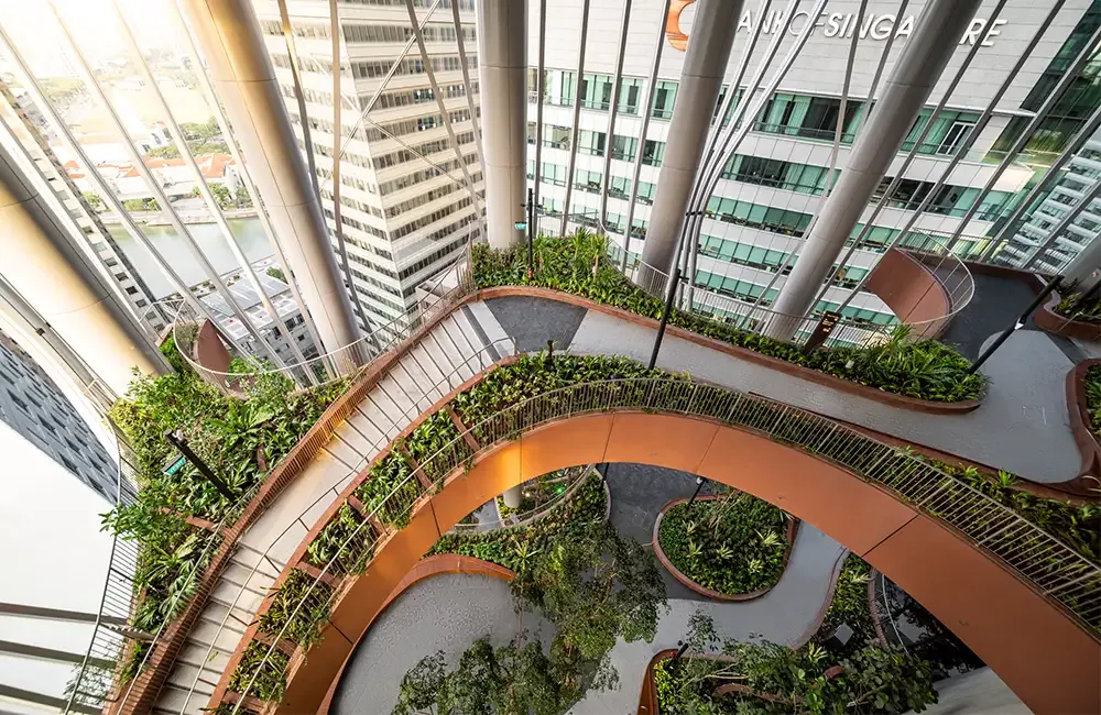 Landscaped gardens inside a tall glass building