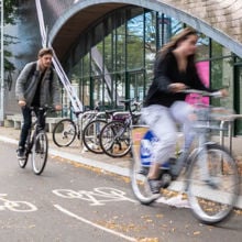 People cycling along the road using a cycle lane